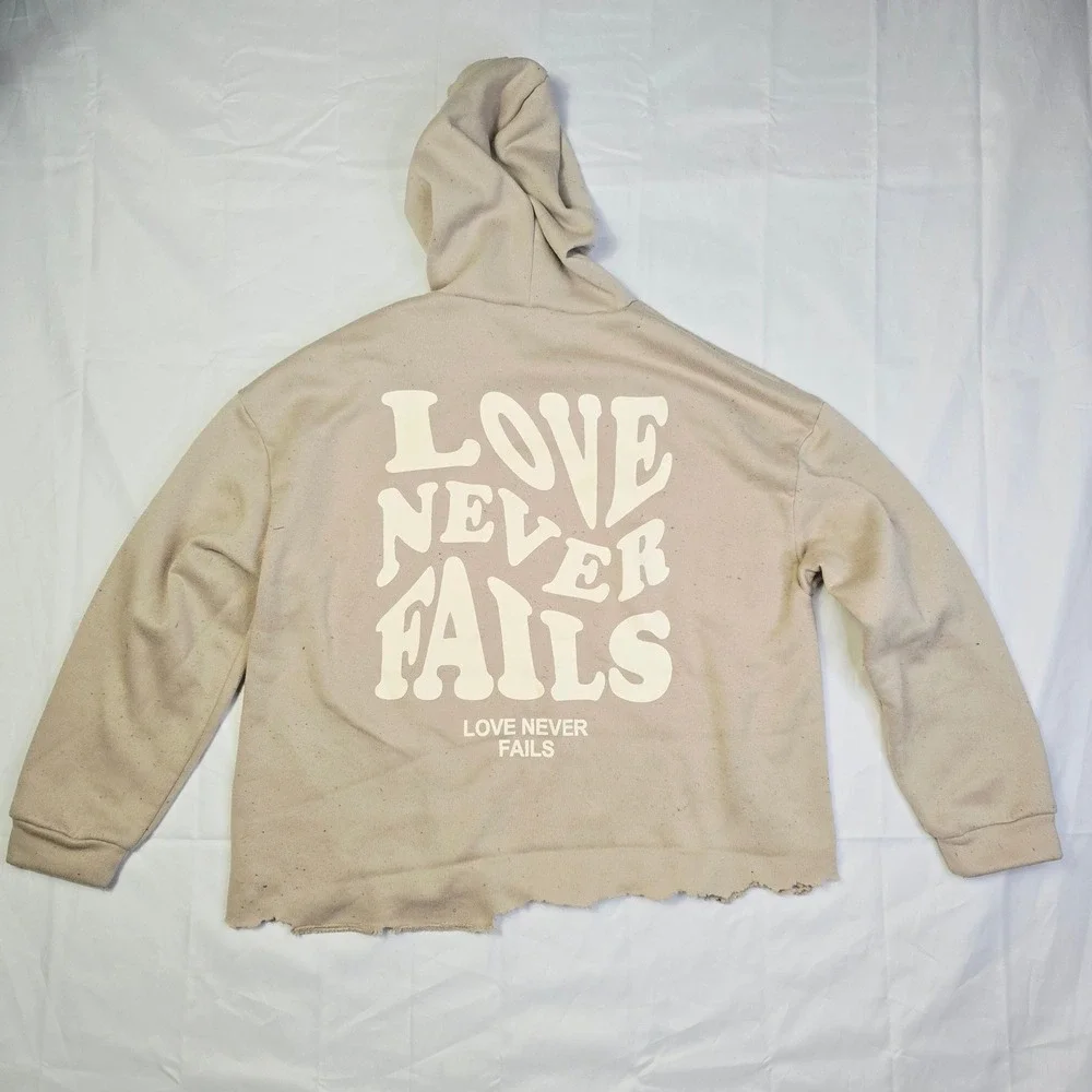 Men's Love Never Fails Fleece Hoodie Size M Beige Distressed Raw Hem T3
